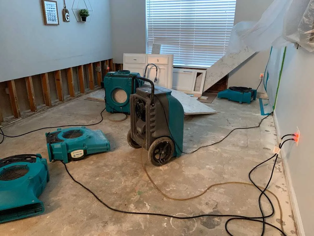 Dehumidifier in flood-cut room for Water Damage Restoration in Lakewood